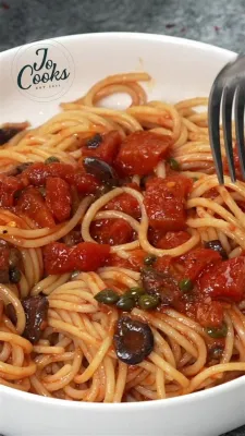 Spaghetti alla Puttanesca -  Savory Tomato Flavors Meet Briny Olives and Capers for an Italian Explosion!